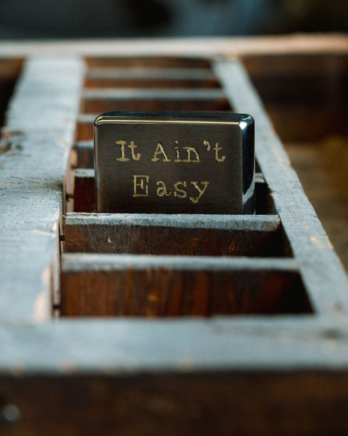 "It Ain't Easy" Zippo - Hand-Engraved Lighter (Brushed Chrome)